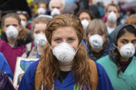 Doctors gather to protest in support of Extinction Rebellion (XR) at Jubilee Gardens, London, Saturday Oct. 12, 2019, to highlight deaths caused by air pollution. Environmental protests have been taking place in cities around the world. (Dominic Lipinski/PA via AP)