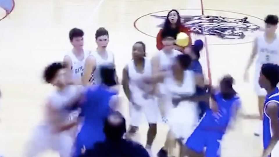 The moment a brawl breaks out between two high school basketball teams in Phoenix, Arizona. Picture: The Arizona Republic