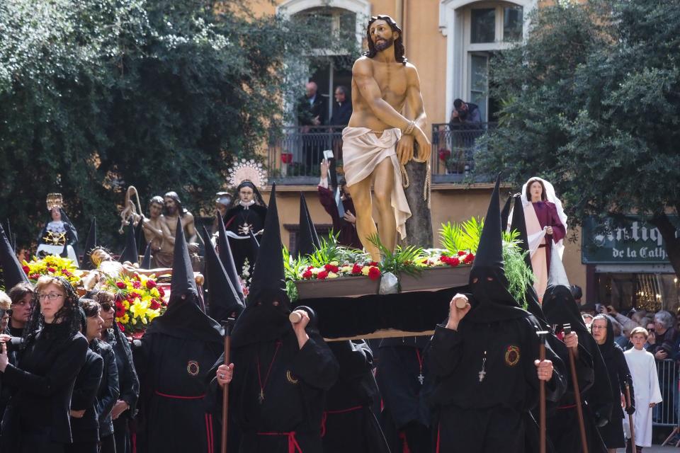 A group of penitents takes part in a traditional Catalan Good Friday procession in the center of Perpignan, southwestern France, on April 19, 2019.  (RAYMOND ROIG via Getty Images)