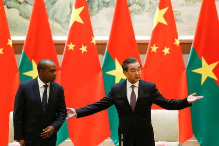 China's Foreign Minister Wang Yi and Burkina Faso Foreign Minister Alpha Barry attend a signing ceremony establishing diplomatic relations between the two countries in Beijing, China, May 26, 2018. REUTERS/Thomas Peter/Pool