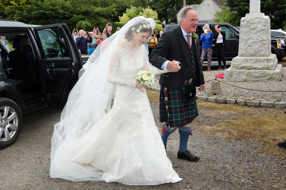 <p>‘Game of Thrones’ co-stars Rose Leslie and Kit Harington tied the knot in a traditional ceremony at Rayne Church in Aberdeen on 23 June. For the big day, Leslie opted for an Elie Saab dress from the label’s SS18 line which cost a cool £20,000. The actress complimented her bridal look with a floor-sweeping veil and floral head garland. <em>[Photo: Getty]</em> </p>