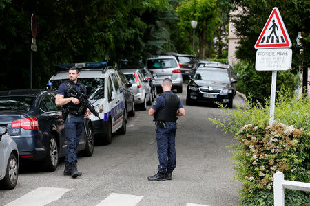 Investigators are seen during a police operation in Oullins, near Lyon, France May 27, 2019. REUTERS/Emmanuel Foudrot