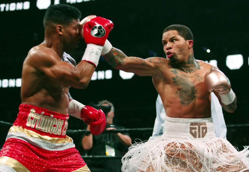 CORRECTS DATE - Gervonta Davis, right, lands a punch on Yuriorkis Gamboa during round eight for the WBA lightweight boxing bout Sunday, Dec. 29, 2019, in Atlanta. Davis won the title by a 12th round TKO. (AP Photo/Tami Chappell)