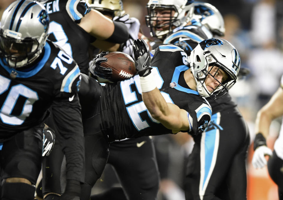 Carolina Panthers' Christian McCaffrey (22) runs against the New Orleans Saints in the first half of an NFL football game in Charlotte, N.C., Monday, Dec. 17, 2018. (AP Photo/Mike McCarn)