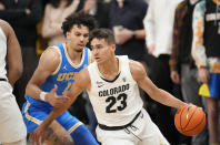 Colorado forward Tristan da Silva, front, is defended by UCLA guard Jules Bernard during the first half of an NCAA college basketball game Saturday, Jan. 22, 2022, in Boulder, Colo. (AP Photo/David Zalubowski)