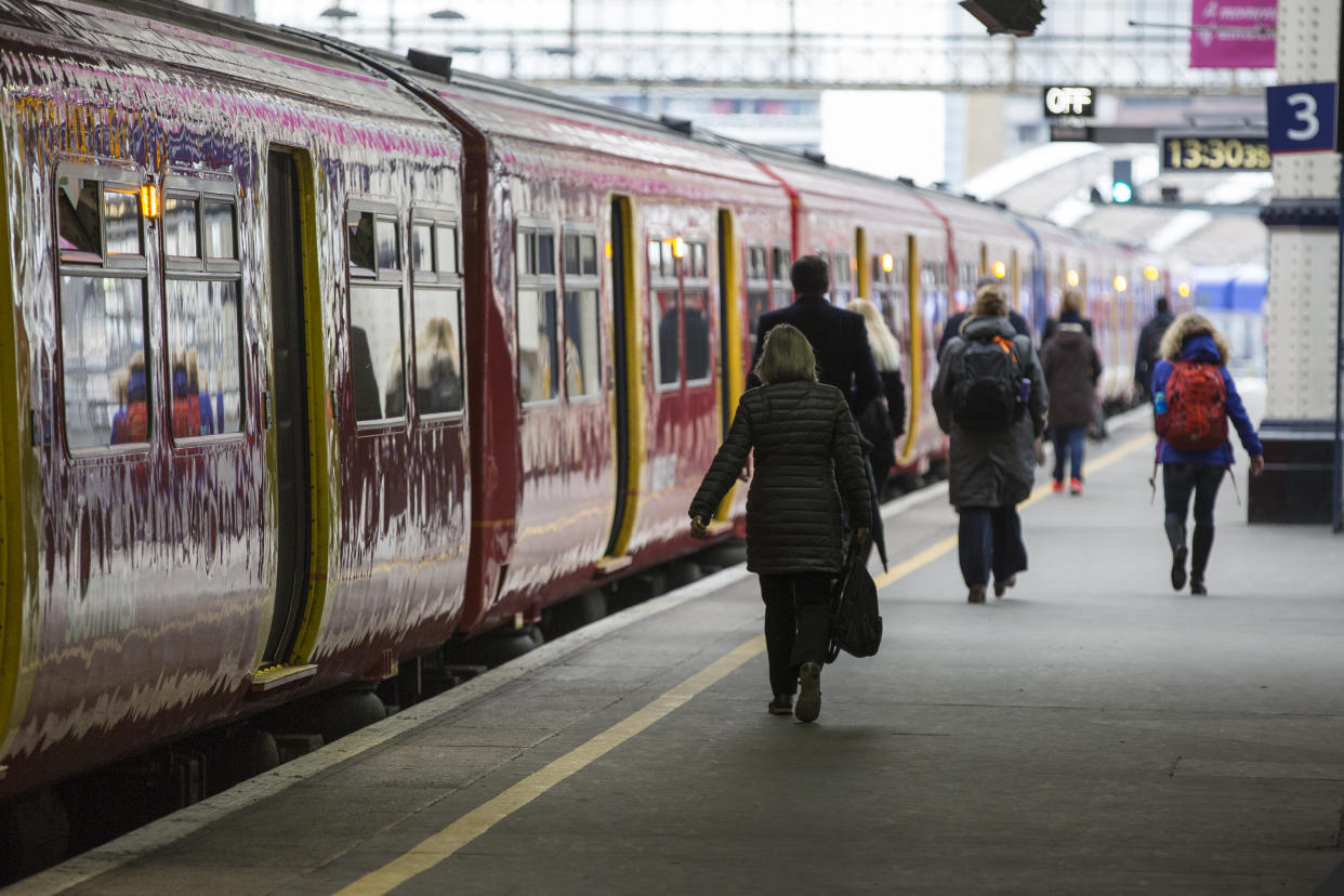 Train on platform with departure passengers