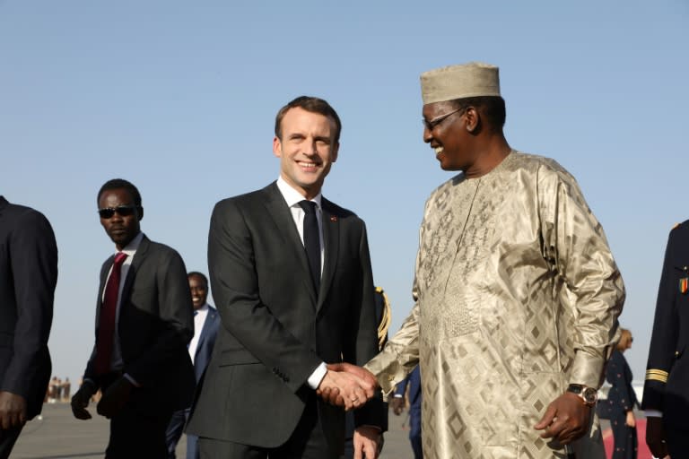 Emmanuel Macron is welcomed by Chad's president Idriss Deby upon his arrival at N'Djamena airport