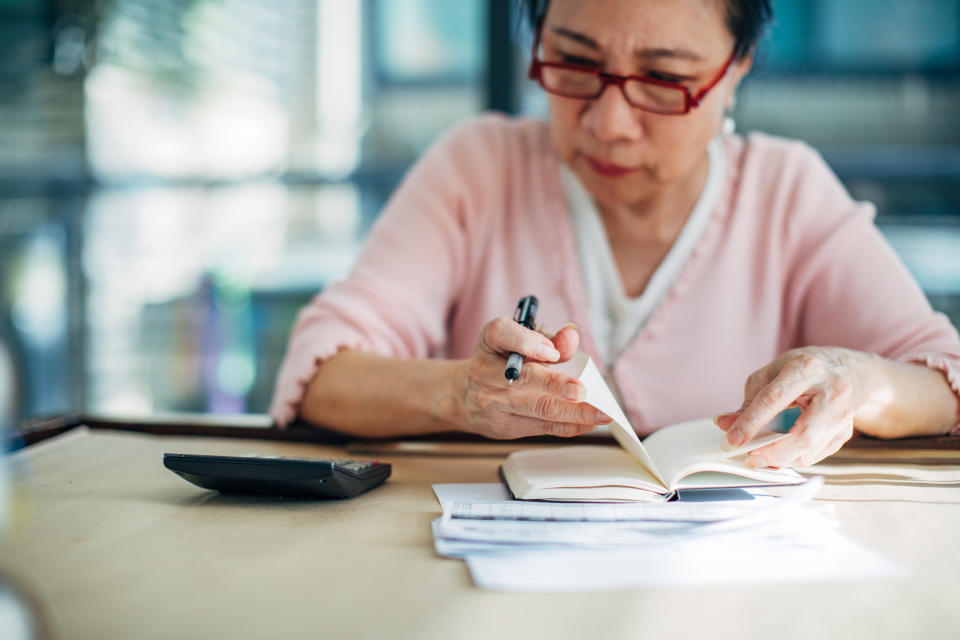 Senior woman doing finances at home