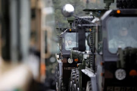 A U.S. Army soldier sits inside their military vehicle as he takes part in Operation Pacific Reach joint logistic exercise in Pohang, South Korea, April 11, 2017. REUTERS/Kim Hong-Ji/Files