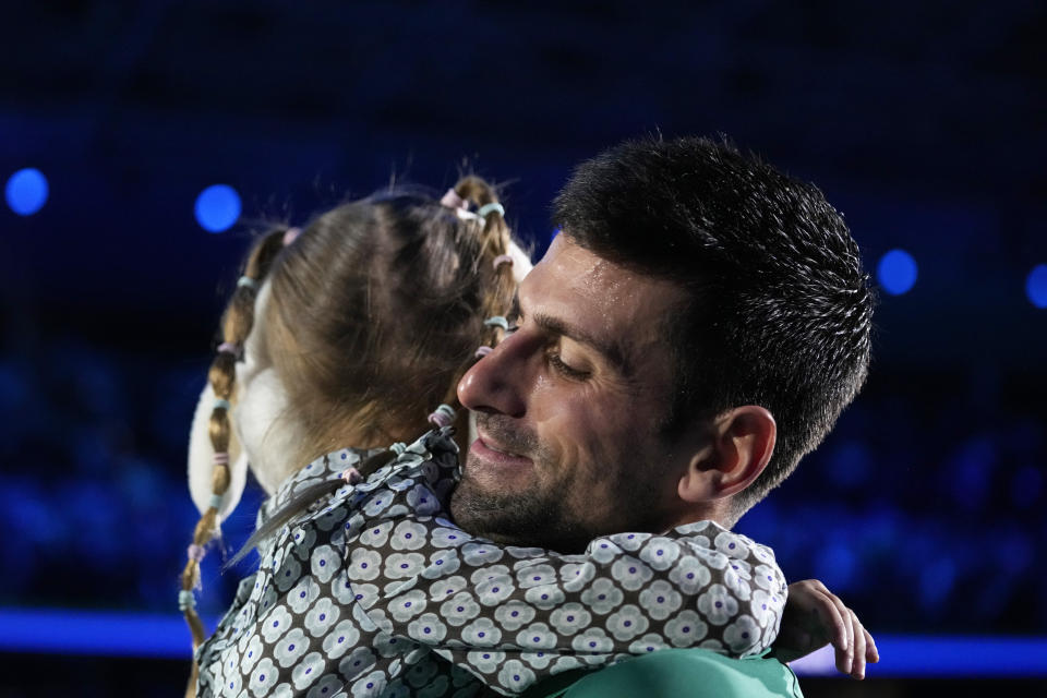 Serbia's Novak Djokovic celebrates with his daughter after defeating Norway's Casper Ruud 7-5, 6-3, in their singles final tennis match of the ATP World Tour Finals at the Pala Alpitour, in Turin, Italy, Sunday, Nov. 20, 2022. (AP Photo/Antonio Calanni)