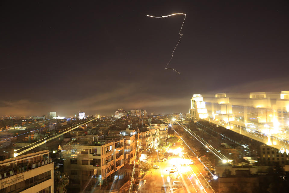 <p>Damascus is seen as the U.S. launches an attack on Syria targeting different parts of the capital early Saturday, April 14, 2018. Syria’s capital has been rocked by loud explosions that lit up the sky with heavy smoke as U.S. President Donald Trump announced airstrikes in retaliation for the country’s alleged use of chemical weapons. (Photo: Hassan Ammar/AP) </p>