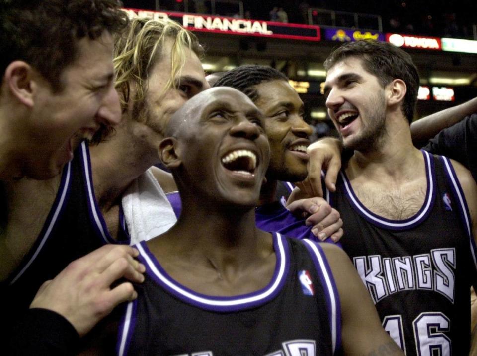 Kings Hedo Turkoglu, Scot Pollard, Bobby Jackson, Nick Anderson and Peja Stojakovic bask in the glory after winning their first playoff series of the Sacramento era against Phoenix in 2001.