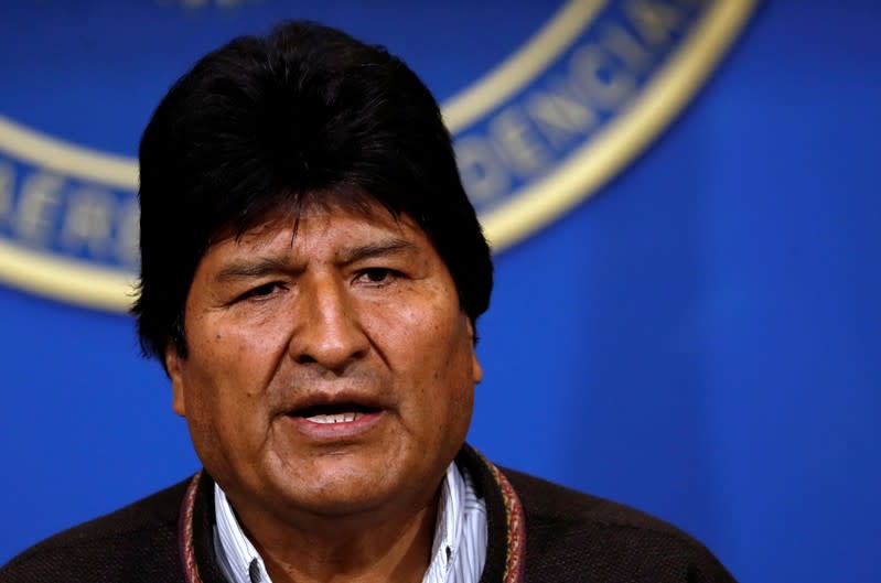 Bolivia's President Evo Morales addresses the media at the presidential hangar in the Bolivian Air Force terminal in El Alto