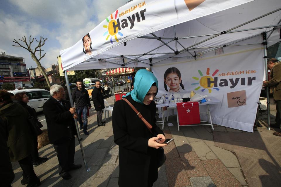 In this Wednesday, March 15, 2017 photo, Turkish supporters of the 'NO' vote for the upcoming referendum campaign in central Istanbul. The entire Turkish referendum campaign has been biased and unfair, those opposed to expanding the president’s powers say, noting they have been hampered by a lack of TV airtime, threats, violence, arbitrary detentions and even sabotage. Those reports come even as Turkish President Recep Tayyip Erdogan himself has slammed European countries for not letting his ministers campaign on their soil for the April 16 vote on expanding his powers. (AP Photo/Lefteris Pitarakis)