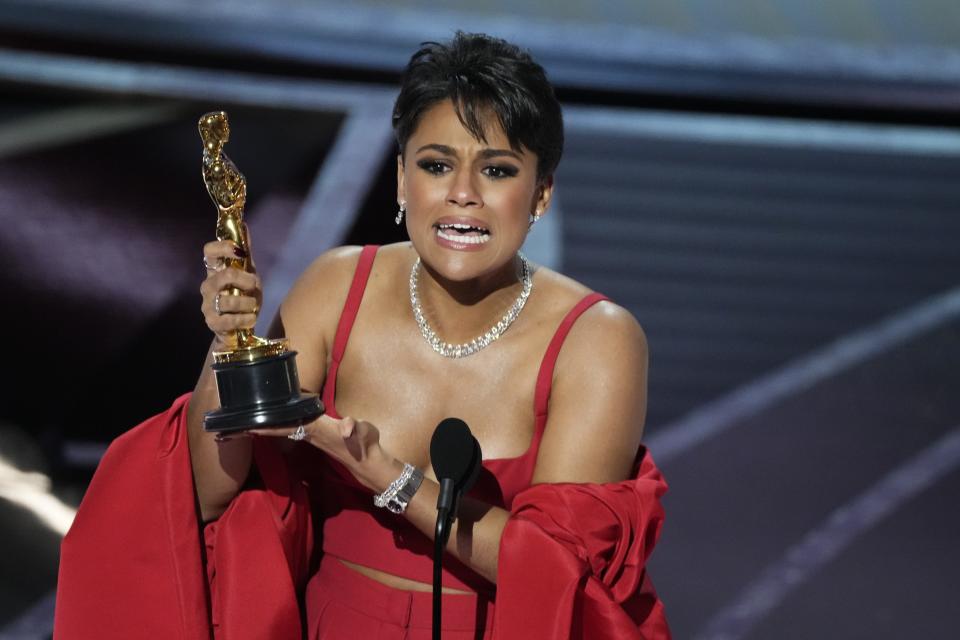 Ariana DeBose accepts the Oscar for best actress in a supporting role for her performance in "West Side Story."