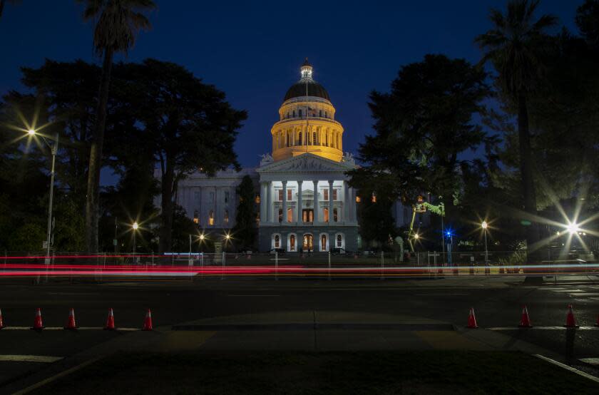 SACRAMENTO, CA - JANUARY 19, 2021: The California State Capitol dome was lit at 2:30pm Tuesday in unison with efforts across the country to memorialize lives lost to Covid on January 19, 2021 in Sacramento, California.(Gina Ferazzi / Los Angeles Times)