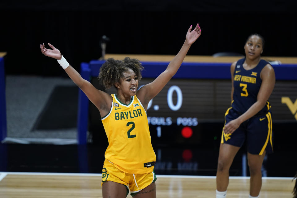 Baylor's DiDi Richards celebrates a basket during the first half of an NCAA college basketball game against West Virginia in the final round of the Big 12 Conference tournament in Kansas City, Mo, Sunday, March 14, 2021. (AP Photo/Charlie Riedel)