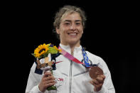 Bronze medalist United States' Helen Louise Maroulis celebrates on the podium for the women's women's 57kg Freestyle wrestling event,at the 2020 Summer Olympics, Thursday, Aug. 5, 2021, in Tokyo, Japan. (AP Photo/Aaron Favila)