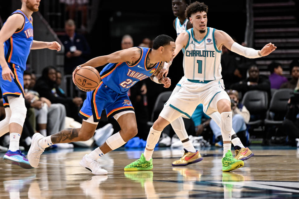 CHARLOTTE, NORTH CAROLINA – OCTOBER 15: Tre Mann #23 of the Oklahoma City Thunder looks to drive past LaMelo Ball #1 of the Charlotte Hornets during the second quarter of his game at Spectrum Center on October 15, 2023 in Charlotte, North Carolina. (Photo by Matt Kelley/Getty Images)