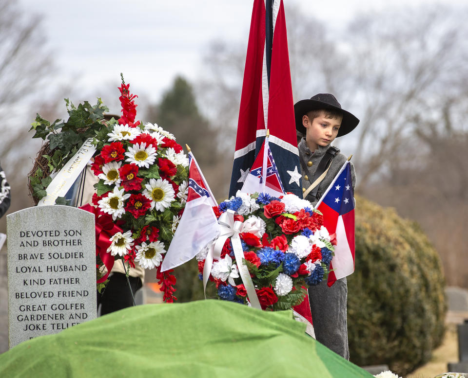 A boy stands during the ceremony as the remains of Civil War Gen. A.P. Hill are interred at Fairview Cemetery in Culpeper, Va., Saturday, Jan. 21, 2023. (Peter Cihelka/The Free Lance-Star via AP)