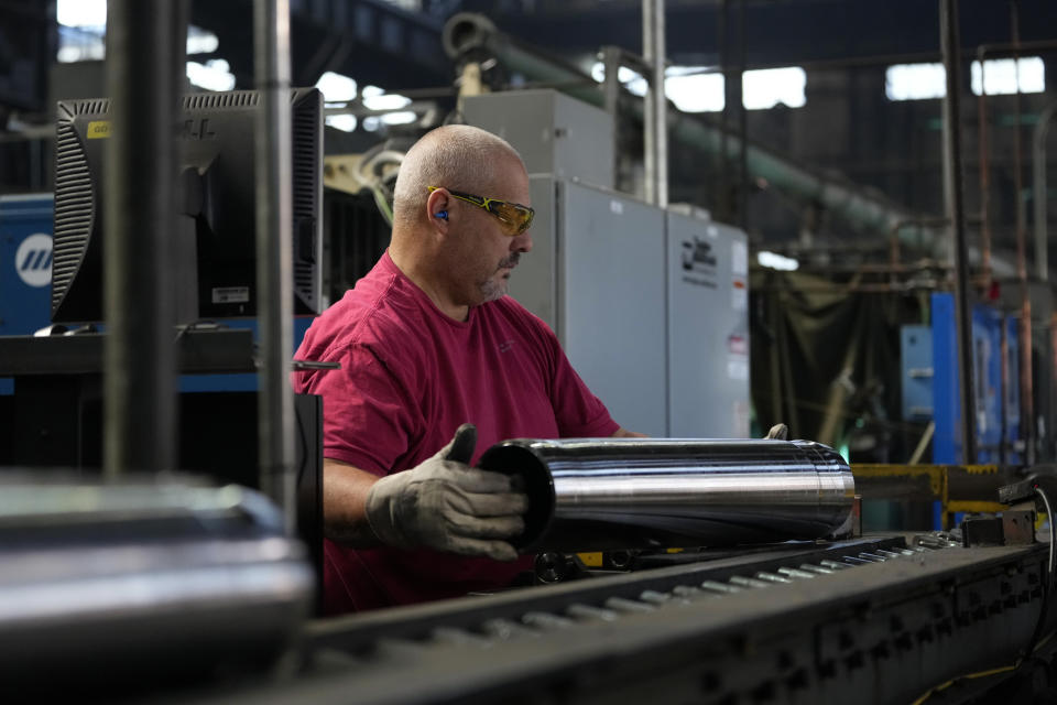 A steel worker manufactures 155 mm M795 artillery projectiles at the Scranton Army Ammunition Plant, Tuesday, Aug. 27, 2024, in Scranton, Pa. (AP Photo/Matt Slocum)