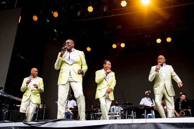 <p>Amy Harris/Invision/AP</p> Alexander Morris (second from left) performing with the Four Tops in September 2022.