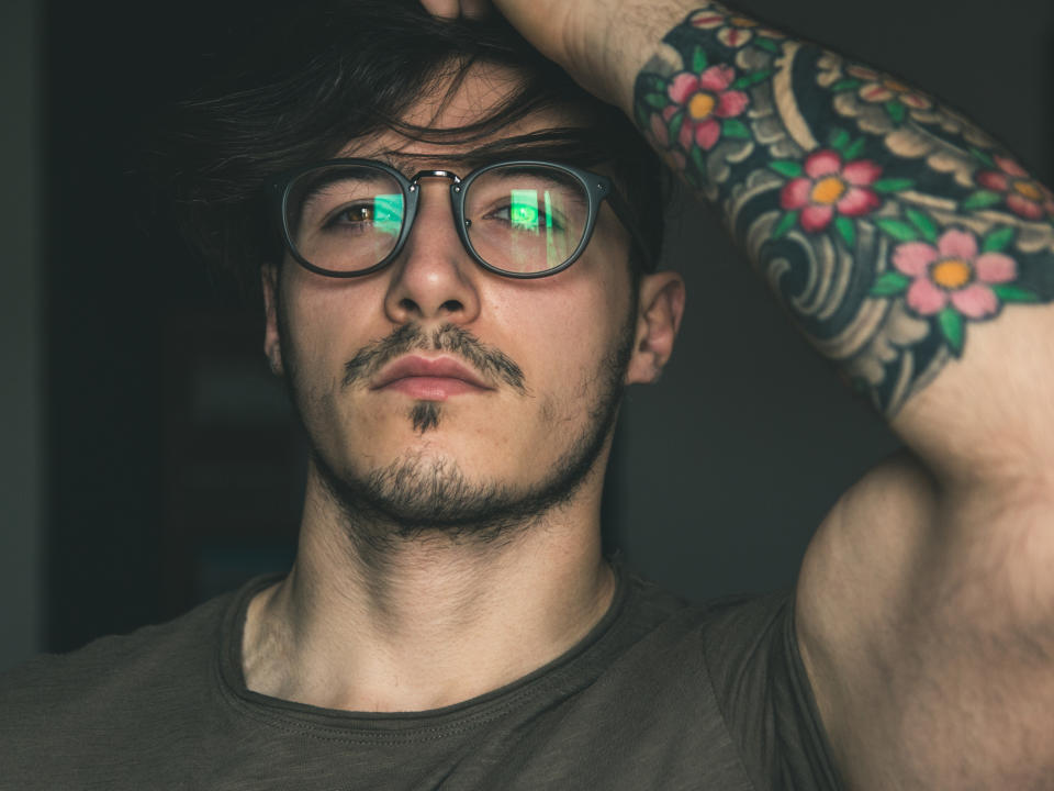 Pictured: Young man with tattoo. Image: Getty