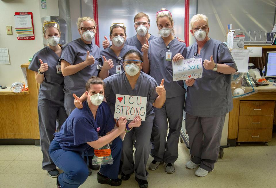 Holy Name Medical Center in Teaneck, New Jersey, during the first few days of the COVID-19 Pandemic.  03/24/2020  Group photo of ICU nurses. Arlene Van Dyk RN is on the far right holding the sign that says "Hi Family. I'm safe. I love you."