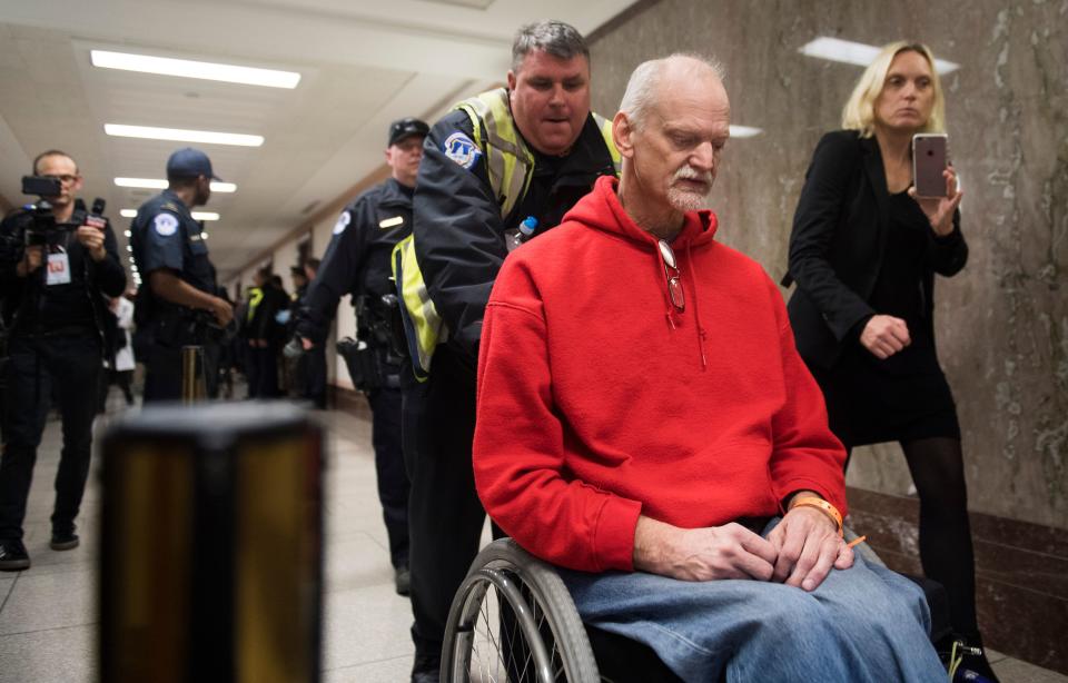 <p>U.S .Capitol Police arrest a protester demonstrating against tax reform outside a Senate Budget Committee hearing on Capitol Hill in Washington, Nov. 28, 2017. (Photo: Saul Loeb/AFP/Getty Images) </p>