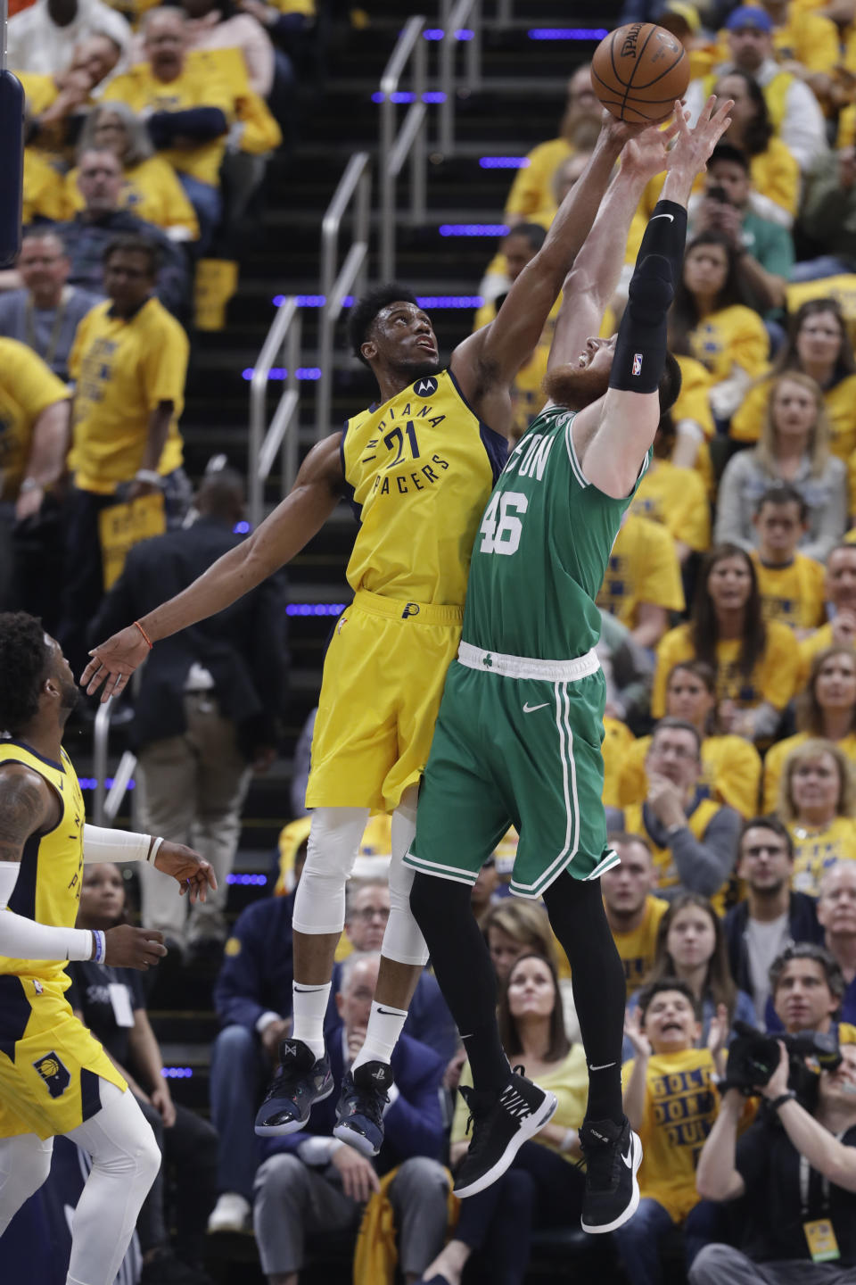 Indiana Pacers forward Thaddeus Young (21) blocks the shot of Boston Celtics center Aron Baynes (46) during the first half of Game 3 of an NBA basketball first-round playoff series Friday, April 19, 2019, in Indianapolis. (AP Photo/Darron Cummings)