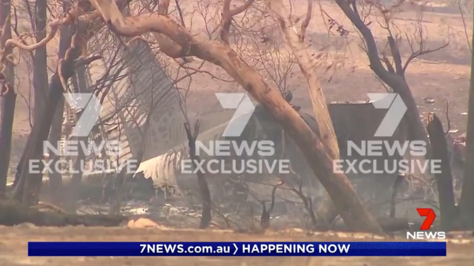 A Coulson Aviation aircraft lies smouldering and smashed in the Snowy Mountains of NSW.