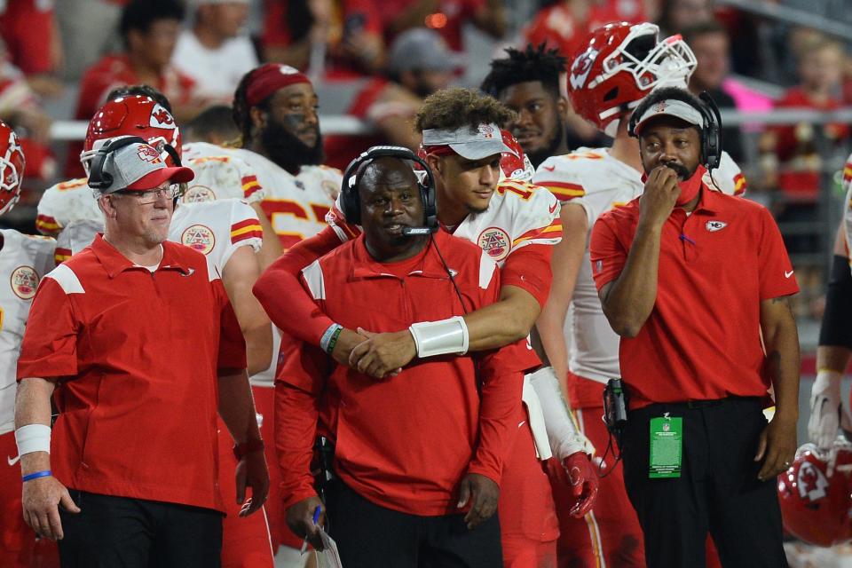 Chiefs quarterback Patrick Mahomes hugs offensive coordinator Eric Bieniemy during a game this season.