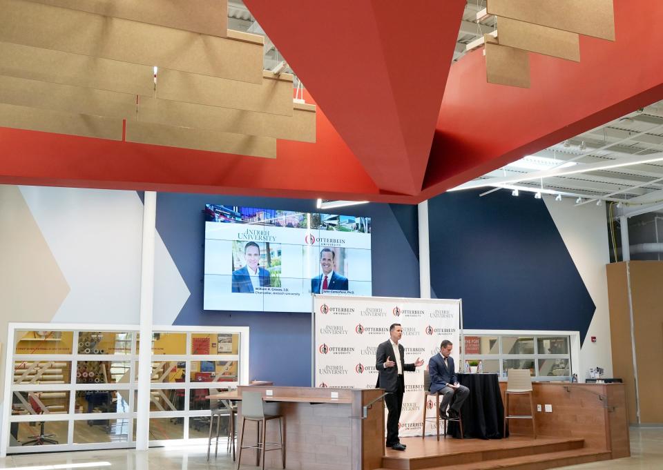 President John Comerford of Otterbein University, left, speaks next to Chancellor William R. Groves of Antioch University, right, during a news conference announcing a partnership between the two schools in July 2022.