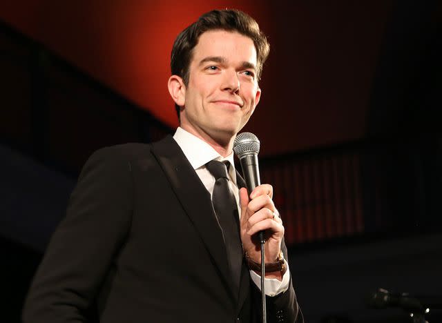 <p>Sylvain Gaboury/Patrick McMullan/Getty</p> John Mulaney speaks onstage during The American Museum of Natural History's 2019 Museum Gala on November 21, 2019 in New York City.