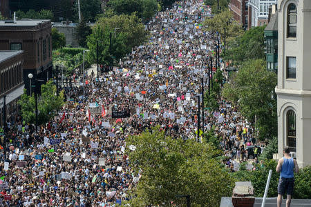 FILE PHOTO: A large crowd of people march towards the Boston Commons to protest the Boston Free Speech Rally in Boston, Massachusetts, U.S., August 19, 2017. REUTERS/Stephanie Keith/File Photo