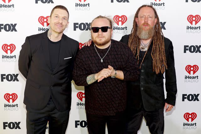 <p>Jesse Grant/Getty</p> Brent Smith, Zach Myers and Barry Kerch of Shinedown