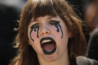 A girl shouts slogans as she marches with others during a climate protest in Brussels, Friday, May 24, 2019. Protesters are holding rallies in several European Union countries to demand tougher action against global warming, as the 28-nation bloc votes to fill the European Parliament. (AP Photo/Francisco Seco)