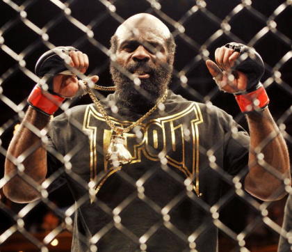 Kimbo Slice celebrates in the cage after a win. (Getty)