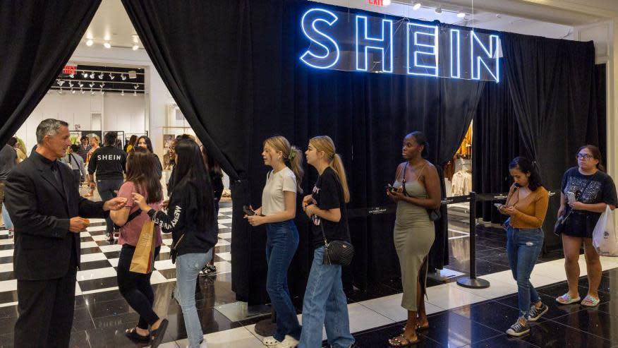 A line of shoppers queuing outside a pop-up Shein store