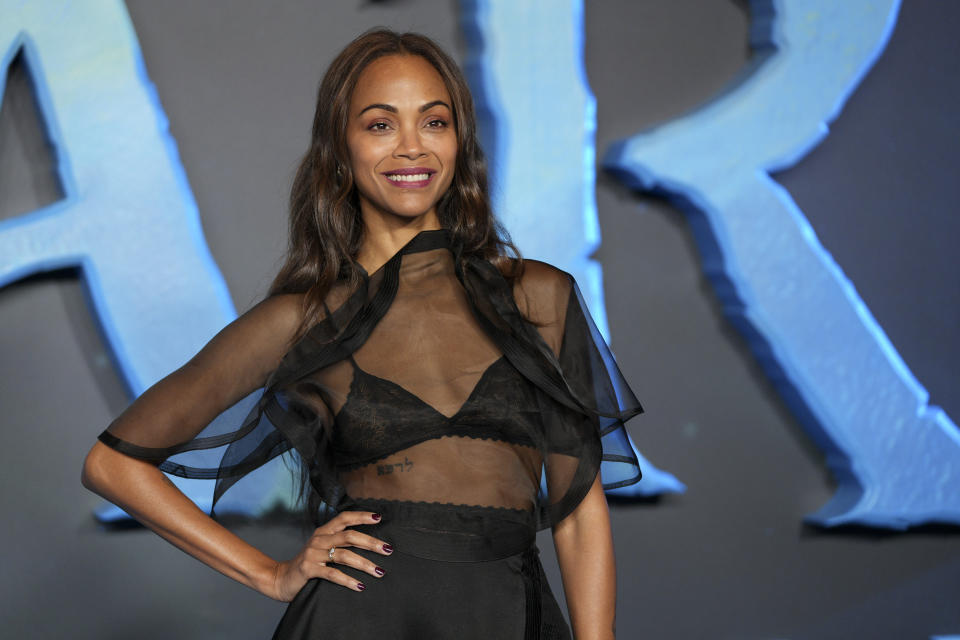 Zoe Saldana poses for photographers during a photo call for the film 'Avatar: The Way of Water' in London, Sunday, Dec. 4, 2022. (Photo by Scott Garfitt/Invision/AP)