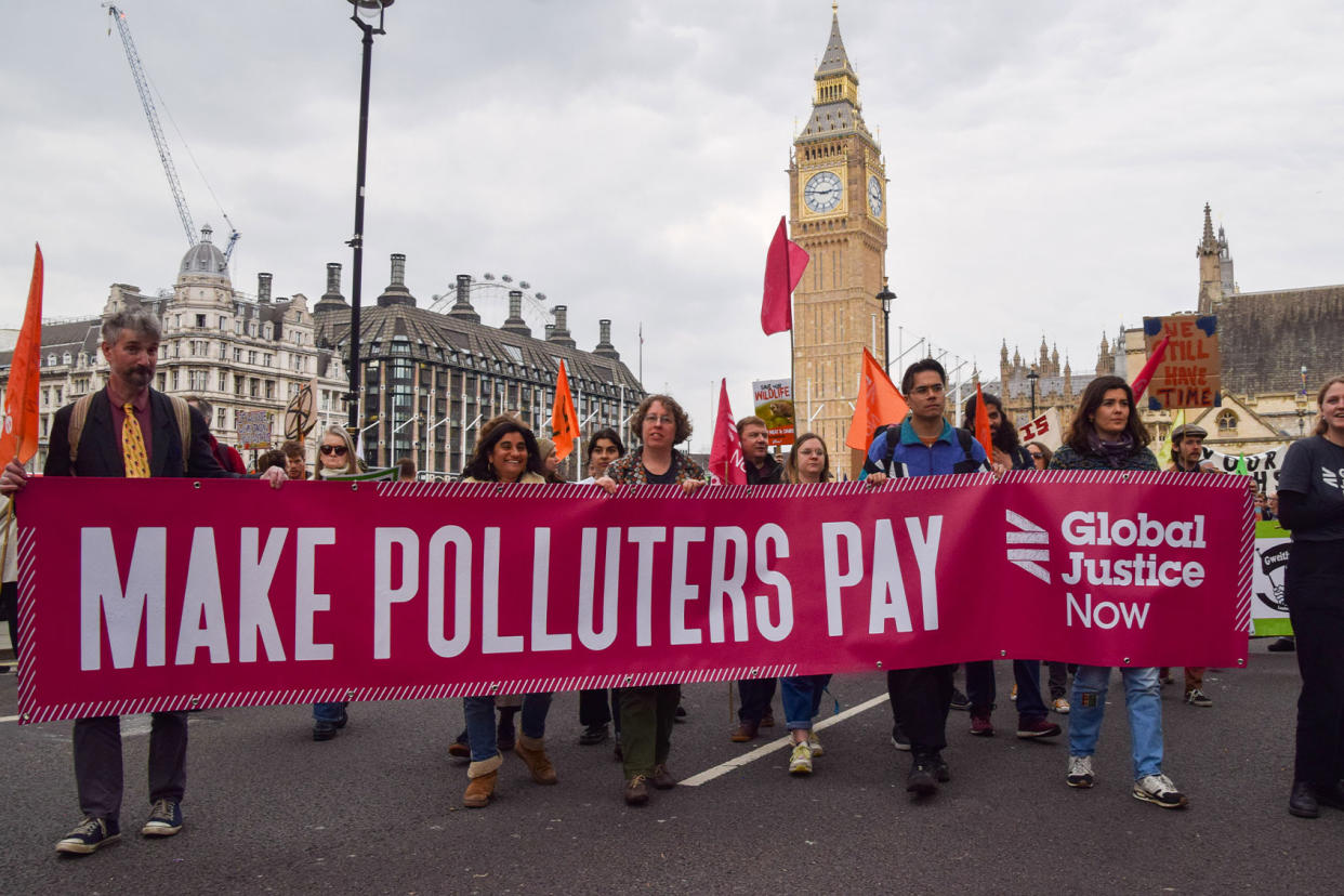 Climate Change Protest Make Polluters Pay Sign Vuk Valcic/SOPA Images/LightRocket via Getty Images
