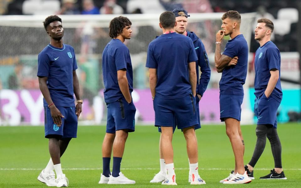 England players check the pitch ahead of the World Cup group B soccer match - AP