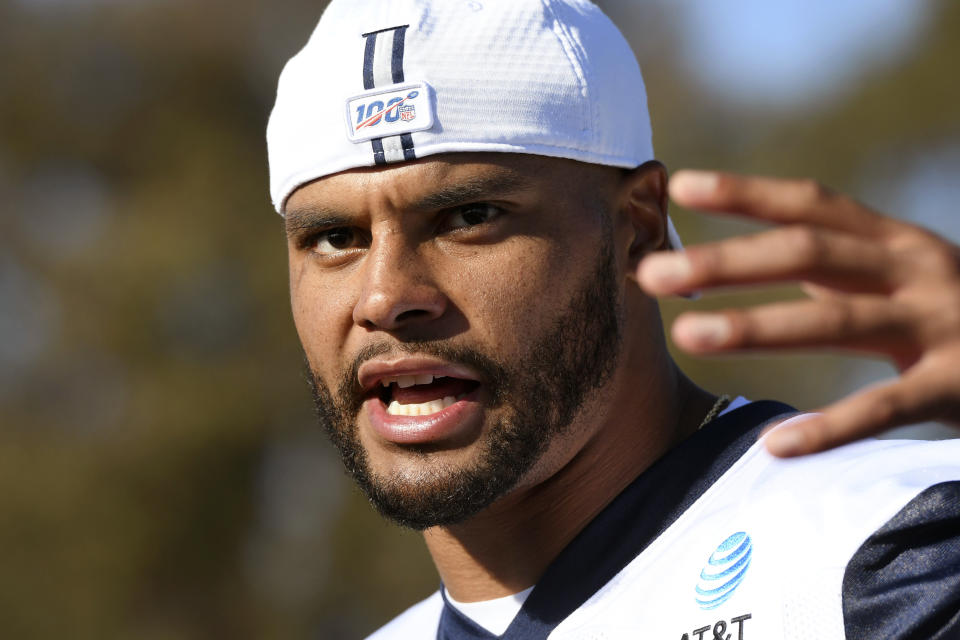 Dallas Cowboys quarterback Dak Prescott talks to the media following practice at the NFL football team's training camp in Oxnard, Calif., Saturday, July 27, 2019. (AP Photo/Michael Owen Baker)