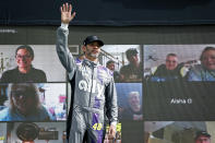 Jimmie Johnson waves to the crowd during driver introductions prior to a NASCAR Cup Series auto race at Phoenix Raceway, Sunday, Nov. 8, 2020, in Avondale, Ariz. (AP Photo/Ralph Freso)