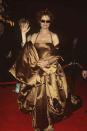 <p> The actress arrived to the 1996 Oscars in a Dolce & Gabbana gold gown. She matched the Academy Award statue. </p>