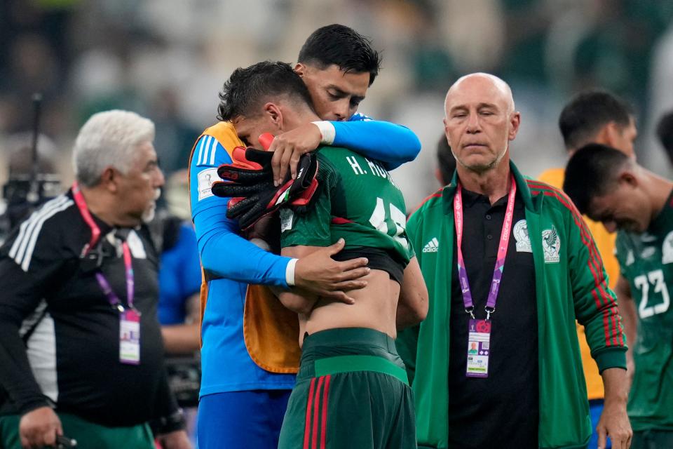 Mexico's Hector Moreno and goalkeeper Alfredo Talavera react at the end of the World Cup group C soccer match between Saudi Arabia and Mexico, at the Lusail Stadium in Lusail, Qatar, Wednesday, Nov. 30, 2022. Mexico won 2-1 but failed to advance in the tournament. (AP Photo/Ricardo Mazalan) ORG XMIT: XAF150