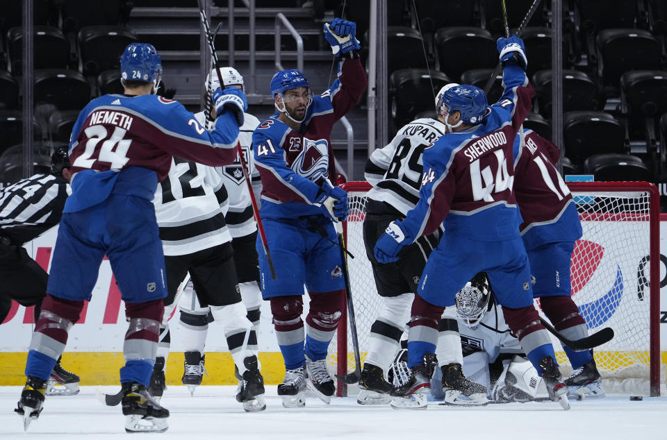 Colorado Avalanche center Pierre-Edouard Bellemare (41) celebrates a goal with teammates against Los Angeles Kings goaltender Calvin Petersen (40) during the first period of an NHL hockey game Wednesday, May, 12, 2021, in Denver. (AP Photo/Jack Dempsey)
