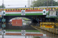 A lorry is stuck in clogged water under Minto rail Bridge after a heavy rain in New Delhi, India, Friday, June 28, 2024. (AP Photo)
