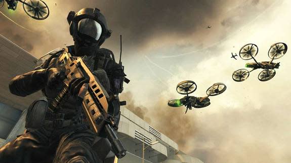 A futuristic soldier stands beneath several armed quadrotor drones in the 2025 setting of the upcoming Call of Duty game.