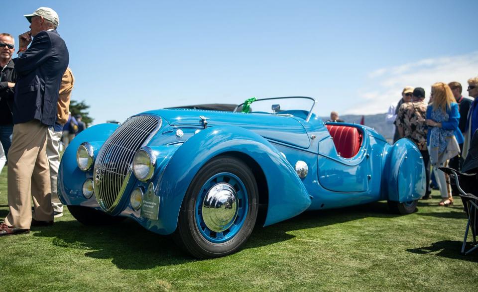 <p>This cheeky number was built by Emile Darl'mat, a Parisian Peugeot dealer, using a standard 2.0-liter Peugeot 302 chassis. The 1930s were the heyday for art deco cars and their flowing, exaggerated lines and fenders that seemed to trail off to infinity. Talbot-Lago, Delahaye, and Bugatti built the most famous and valuable of the art deco cars, but this roadster, of which 53 were built, has a quirkier style than those thoroughbreds. There are six large chrome discs mounted to each the side of the hood and a massive, nearly heart-shaped badge on the tapered rear that reads "Darl'mat." If you took a long, sweeping Delahaye and mated it to, say, a car that Roger Rabbit might drive, this is most likely what you'd end up with.<em>–Daniel Pund</em></p>